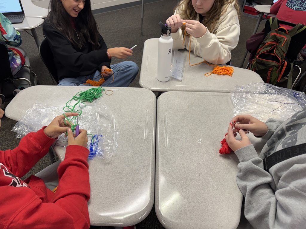 students crocheting