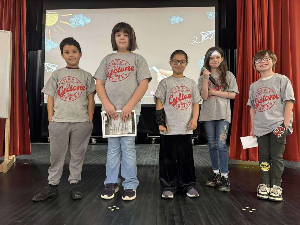 5 Students standing on stage