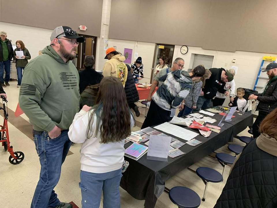 People looking at memorabilia 
