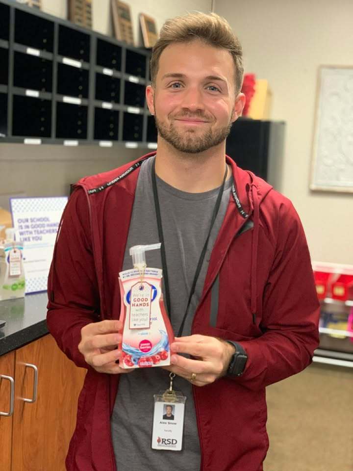 Teacher holding handsoap