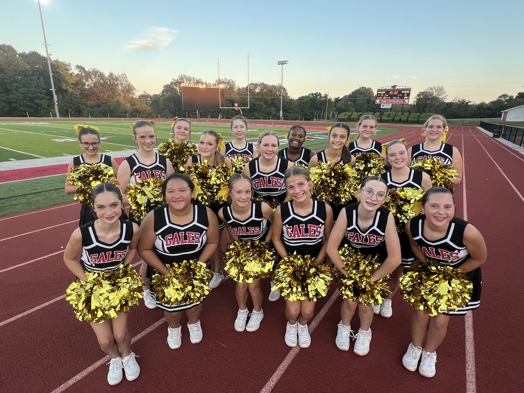 a group of cheerleaders smiling