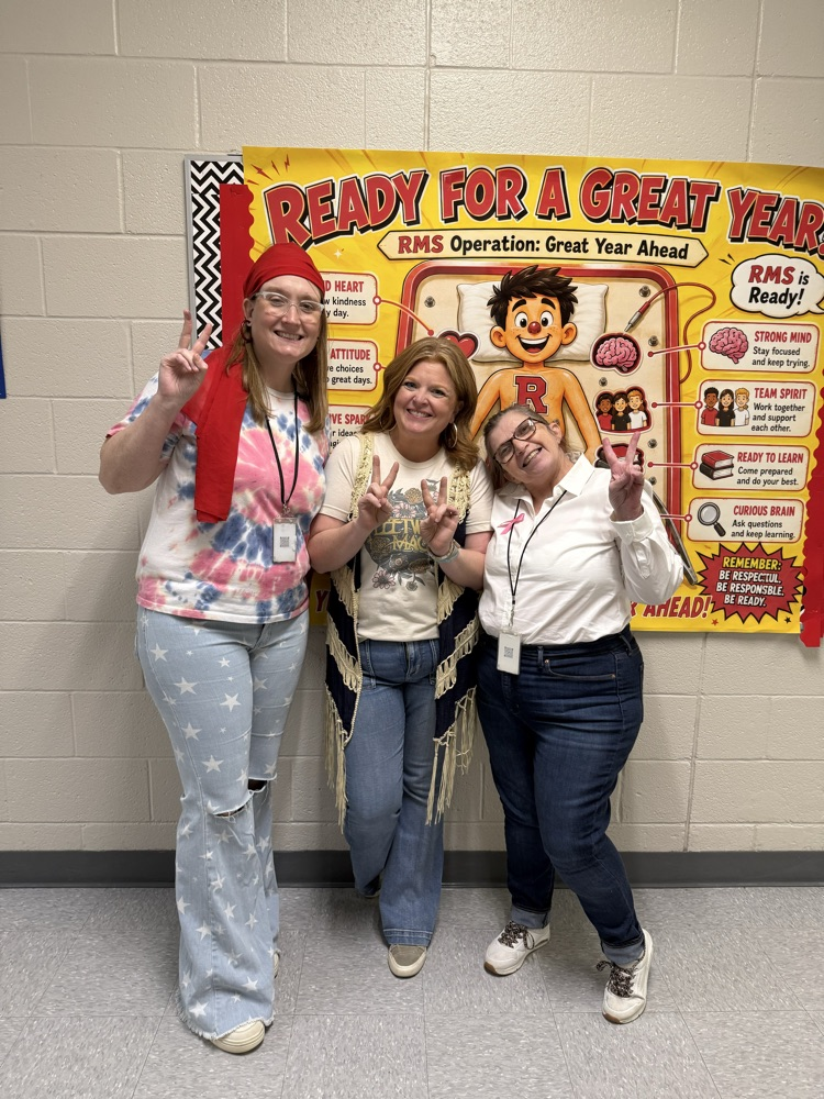 ms Ladd with teachers dress in 70s attire