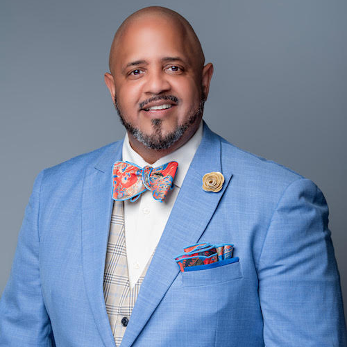 Picture of Dr. Holman in blue suit