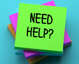 Green sticky note on top of others with bold black letters: "NEED HELP?" Bright blue background.