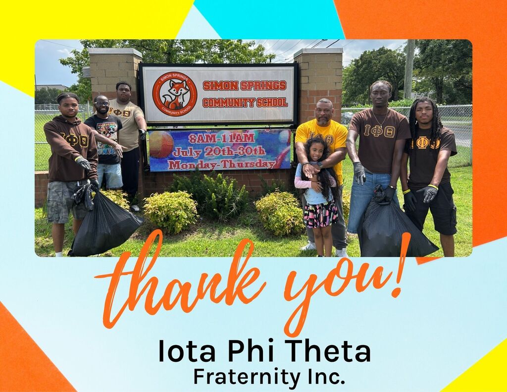 Group of people posing in front of a sign with a colorful background, holding bags. Text reads "Thank you! Iota Phi Theta Fraternity Inc."