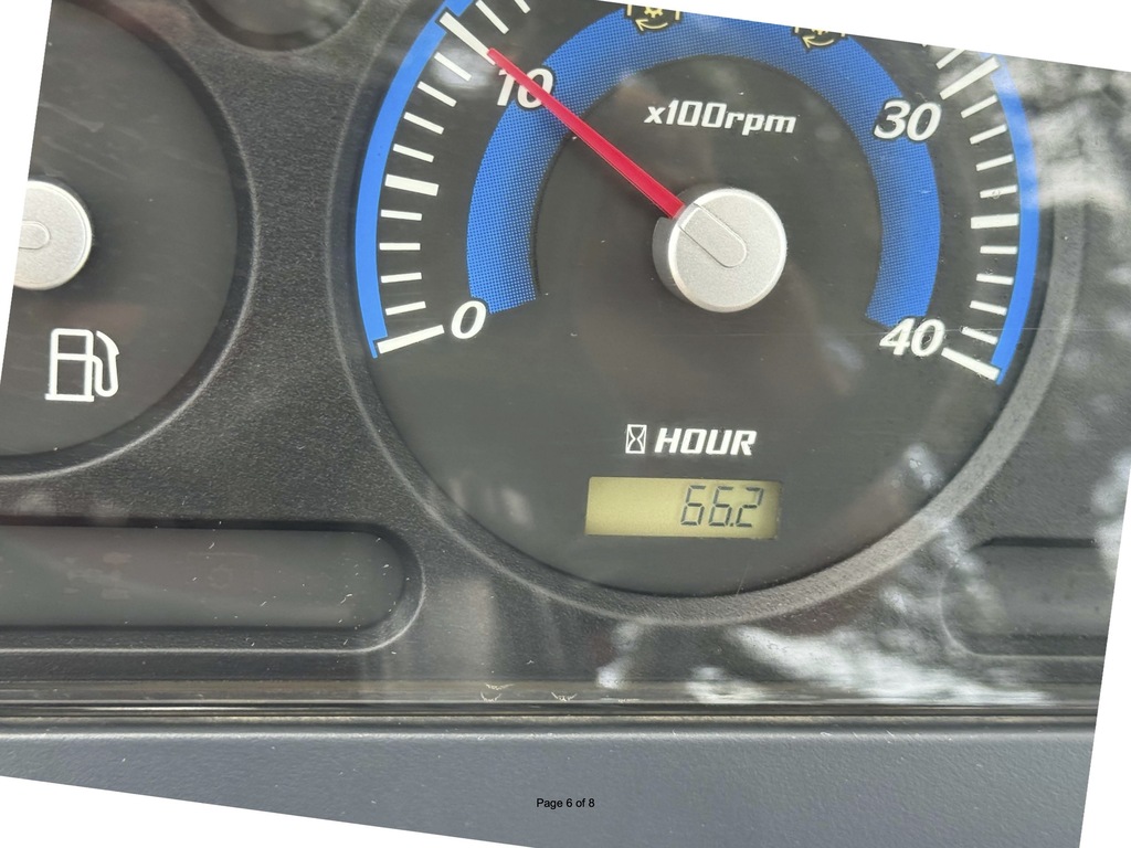 A vehicle dashboard with a speedometer and tachometer showing 652 hours. The fuel gauge is on the left.