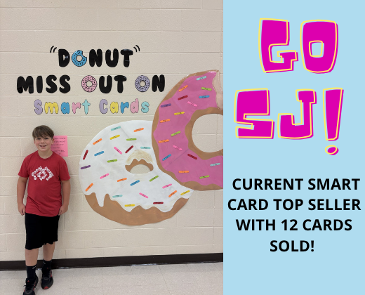 A young boy stands beside a wall featuring a large donut design. The text reads "Donut Miss Out On Smart Cards".