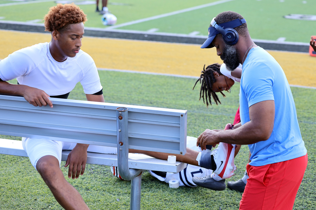 football coach tapes player ankle