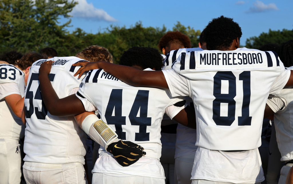 players huddle for prayer