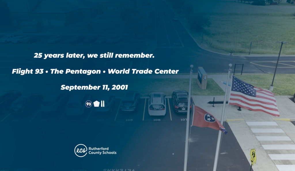 Aerial view of a parking lot with cars parked. Flags on flagpoles. Text reads "Flight 93 - The Pentagon - World Trade Center, September 11, 2001."