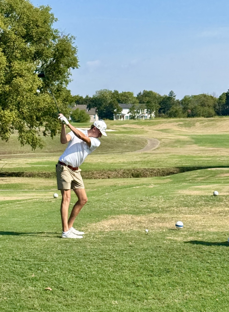 Golfer swings his driver