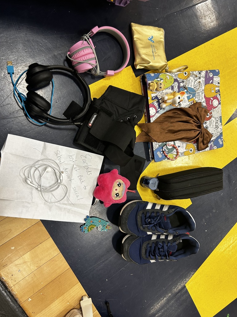 Items on floor include pink headphones, a book, a pink stuffed animal, and a pair of sneakers.