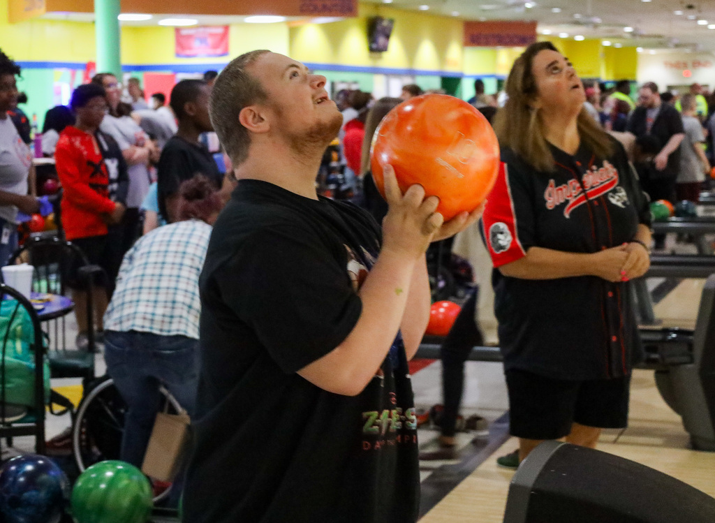 Student holding a bowling ball