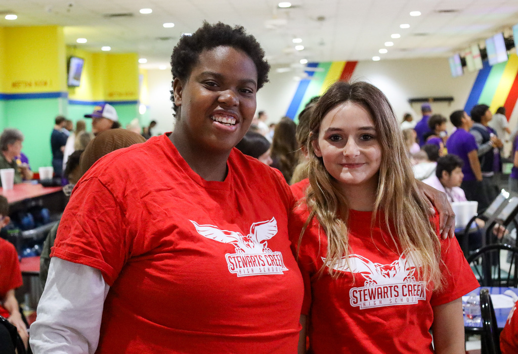 Two students smiling for the camera