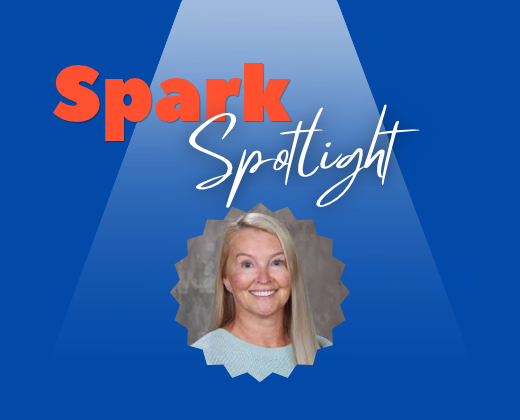 Graphic with a blue background and a spotlight shining from the top center. Large orange text reads “Spark,” with white script text reading “Spotlight” beneath it. A circular, starburst-framed headshot of a staff member is centered under the title. The design resembles a featured staff recognition announcement.