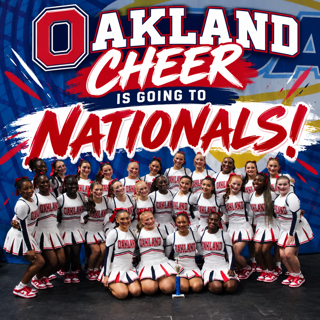 Cheerleaders in white uniforms with red and white trim pose with a trophy in front of a school banner.