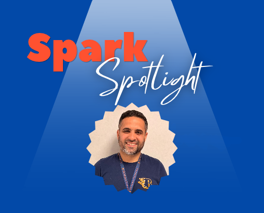 A man smiles with a spotlight behind him. "Spark Spotlight" is written above his head.