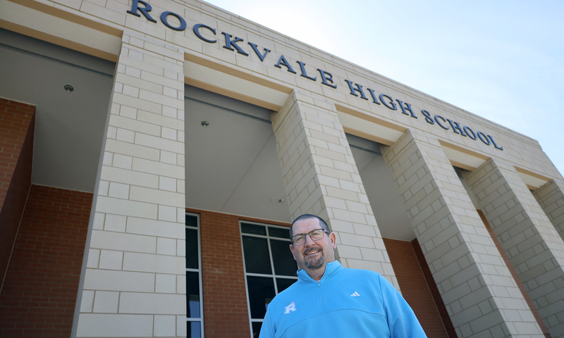 Principal Luker standing in front of Rockvale High school