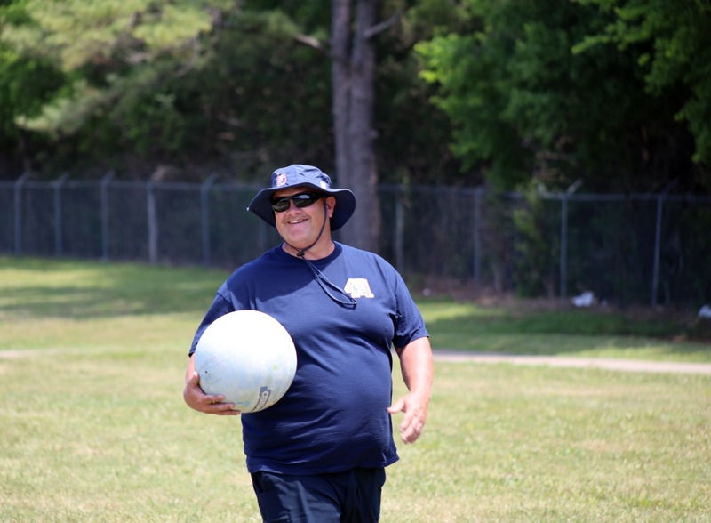 police officer holds kickball