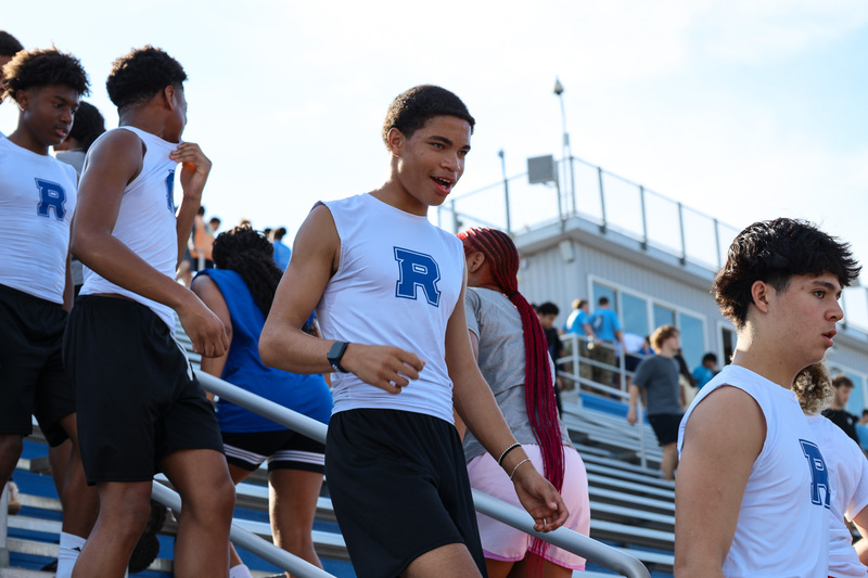 Students climbing down stadium stairs