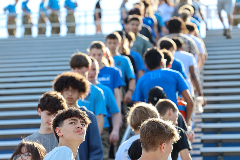 Students climbing stadium stairs