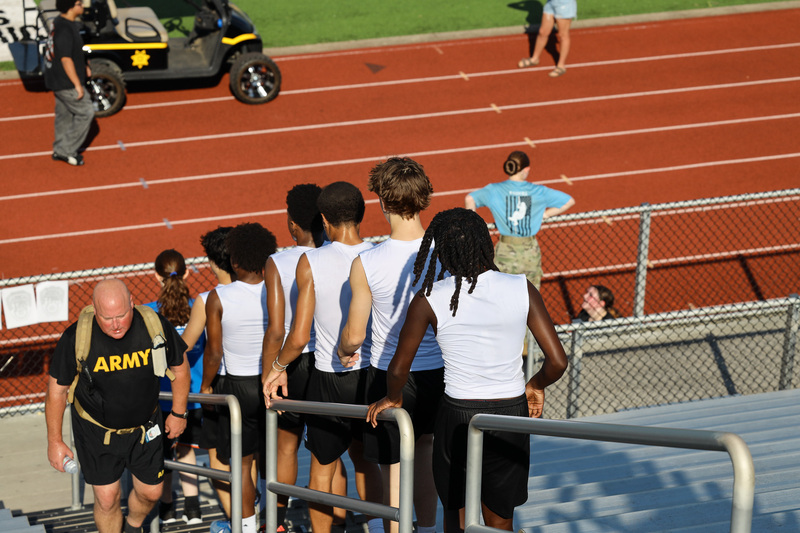 Students climing down stadium stairs