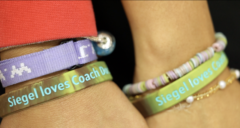 Bracelets inscribed Siegel loves Coach Doc