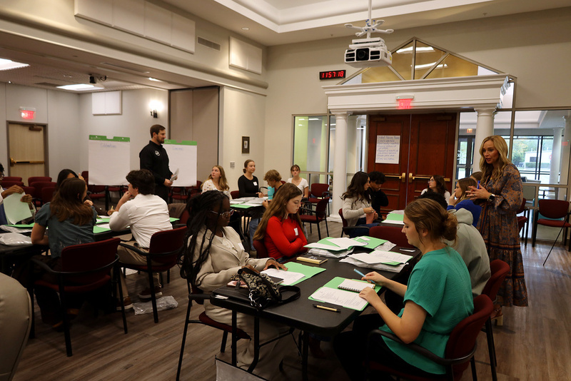 Members of the Student Advisory Council talk with district leaders