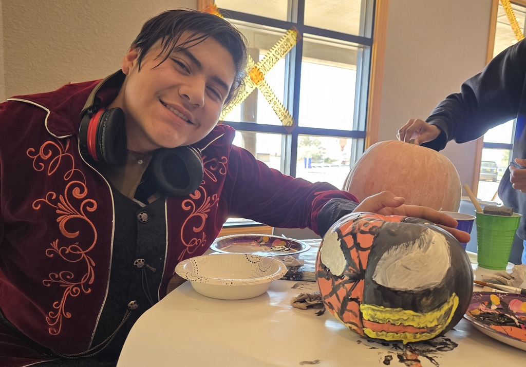Student painting pumkin