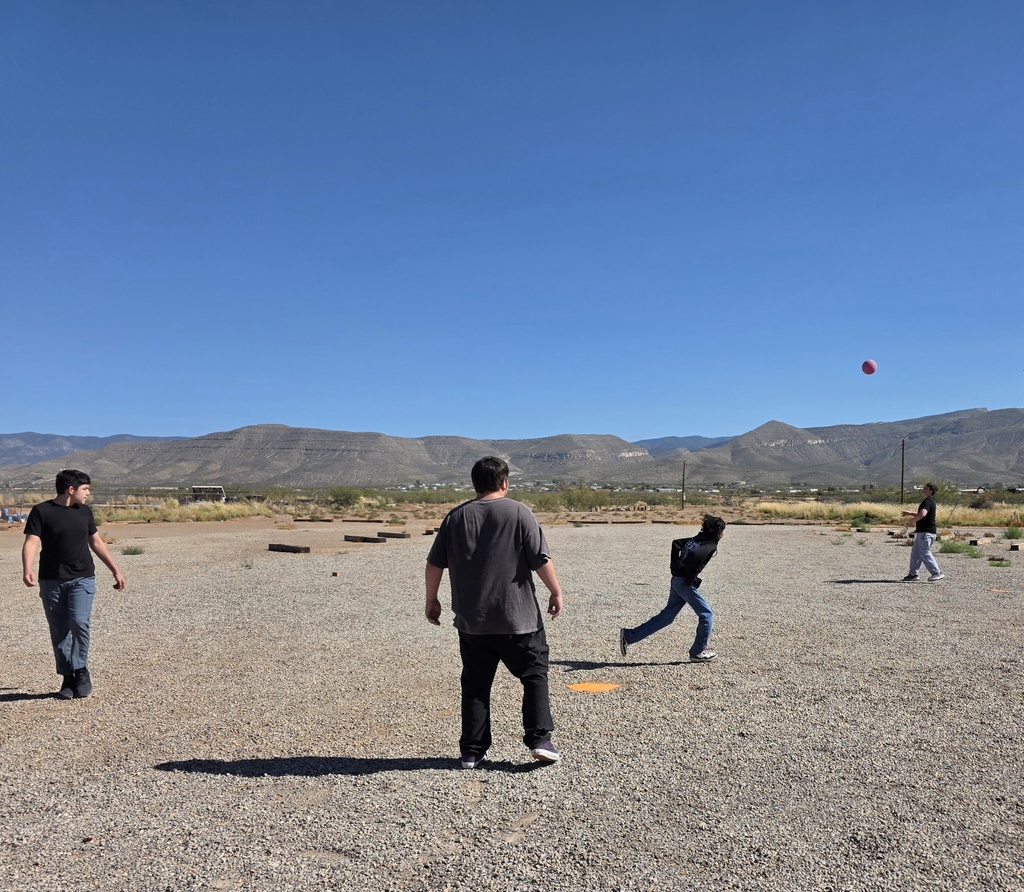 students playing kickball