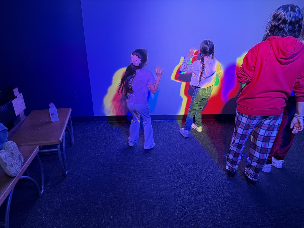 Two students learning and playing with shadows