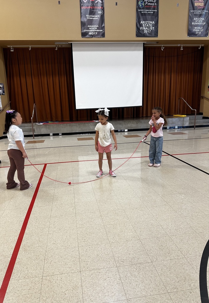 3 girls playing jump rope