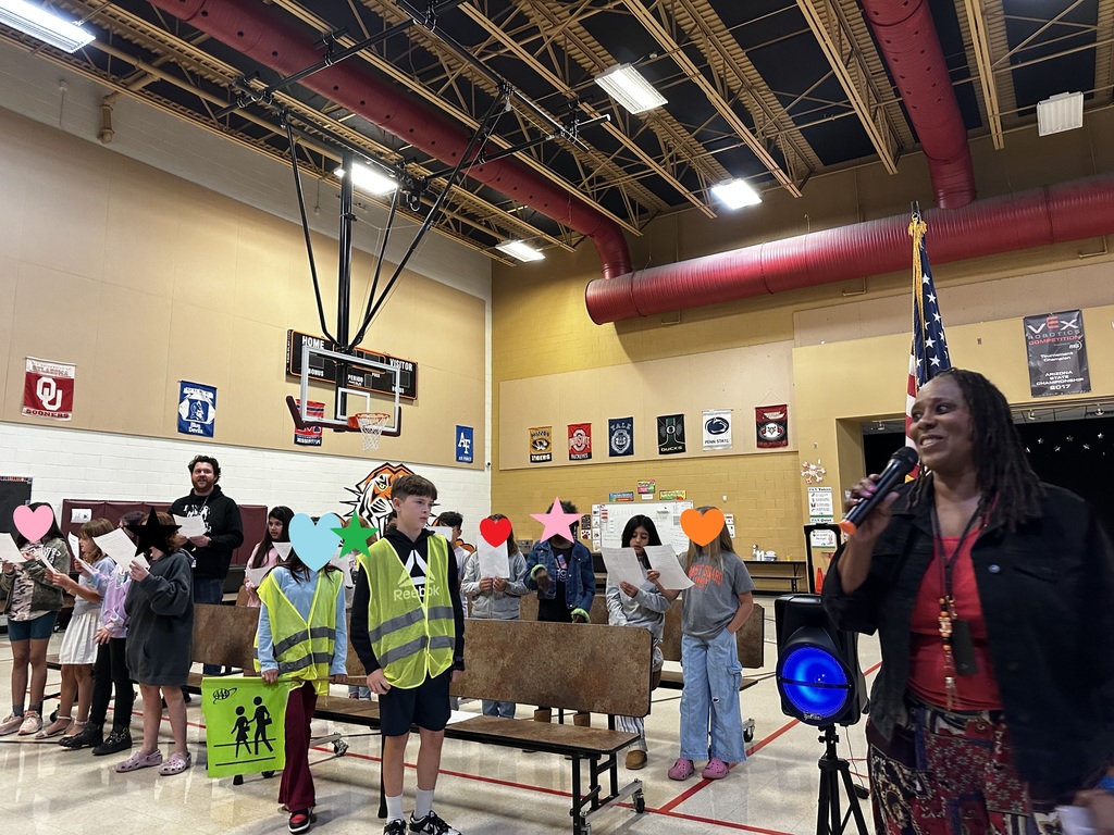 Dr. Scales singing with 4th grade class