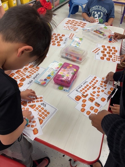 table, pumpkins, classroom floor