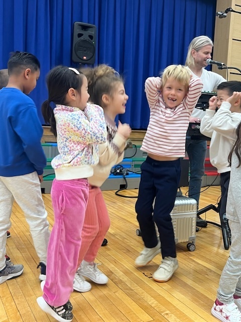 students, stage with synthesizer in an assembly program