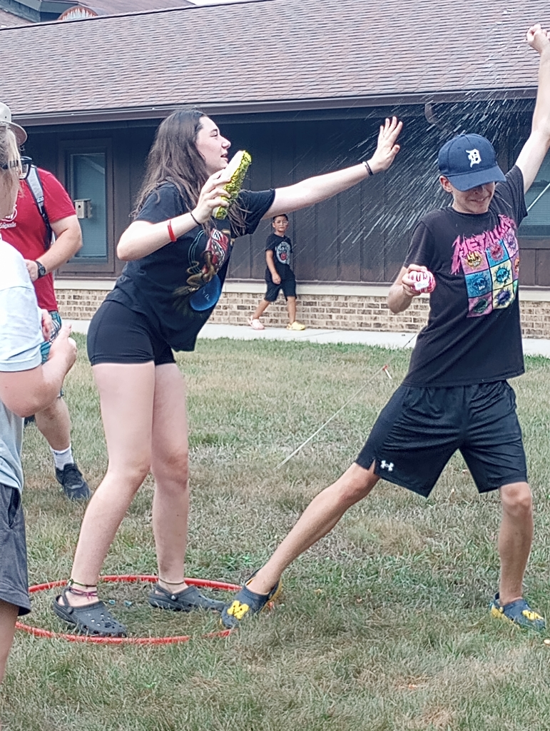 Students playing with water.