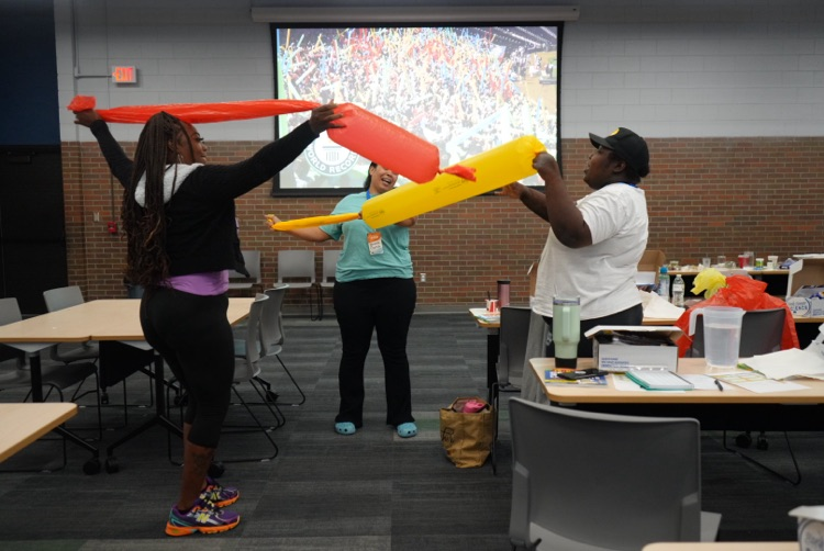 Teachers learning about the science behind air movement. 