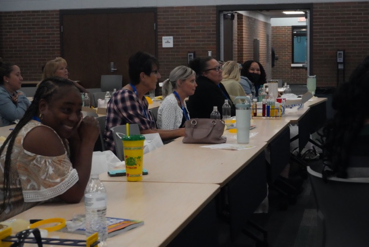 Teachers engaged in PD. 