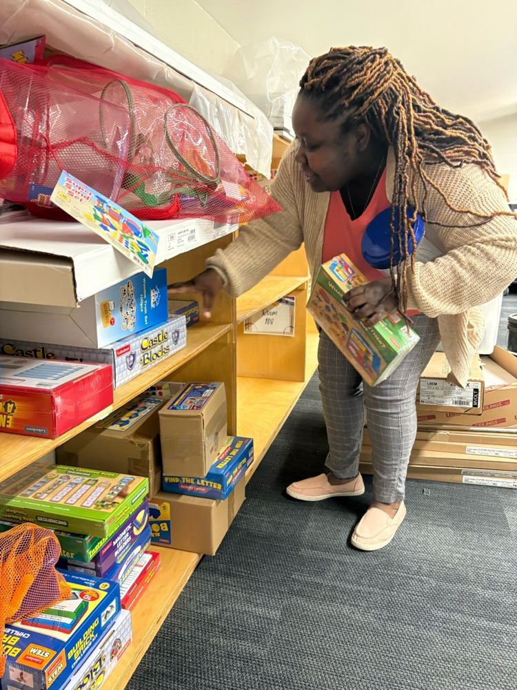Ms. Rimmer is excitingly selecting STEM supplies to display from our schools new STEM resource room! 