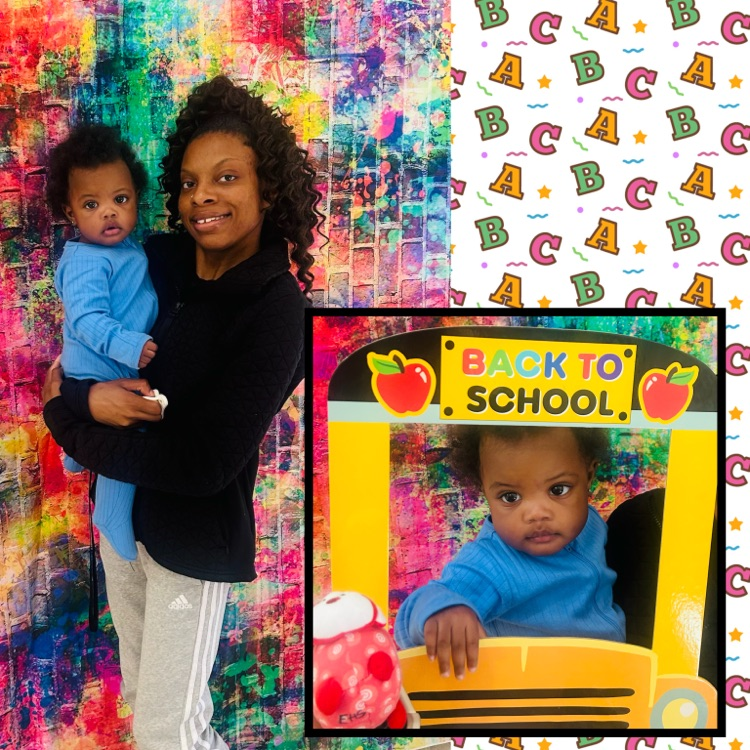 adult and child posing, baby with his face in the bus picture 