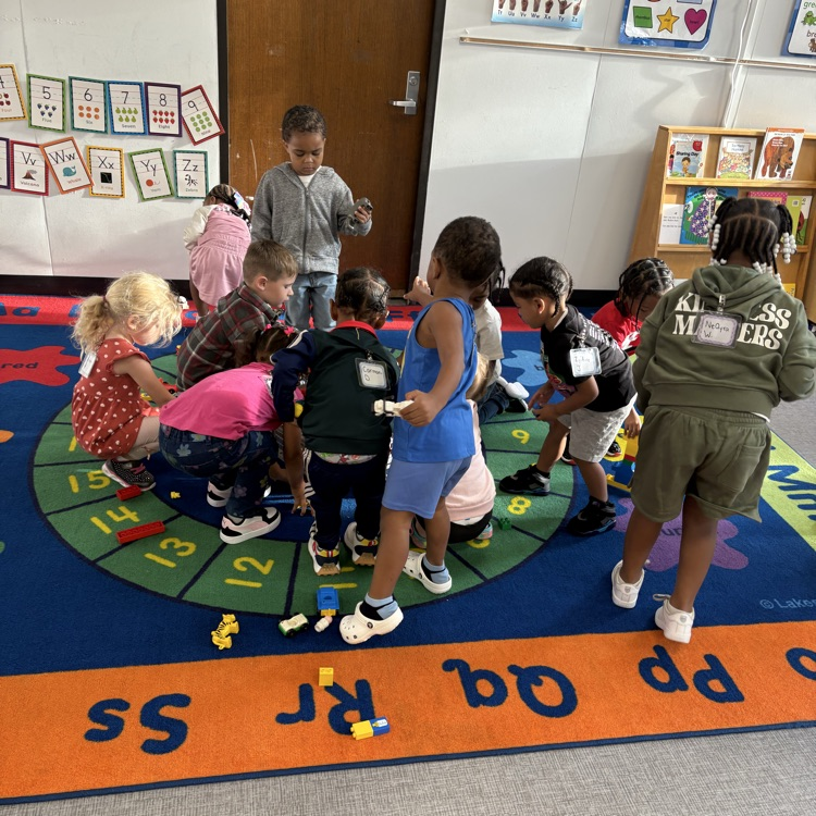 Cleaning up toys before morning meeting 
