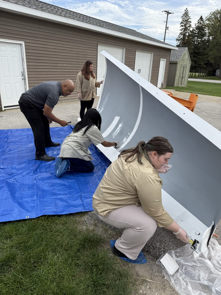 Painting the base of the plow blade