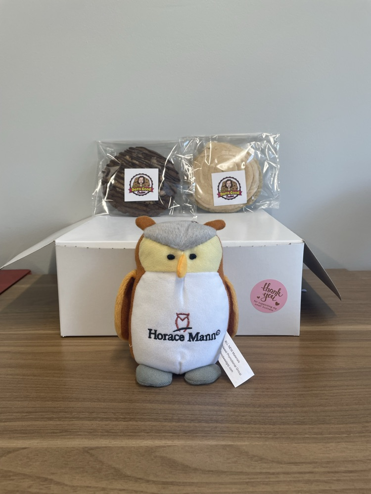 picture or an owl and cookies on top of a box