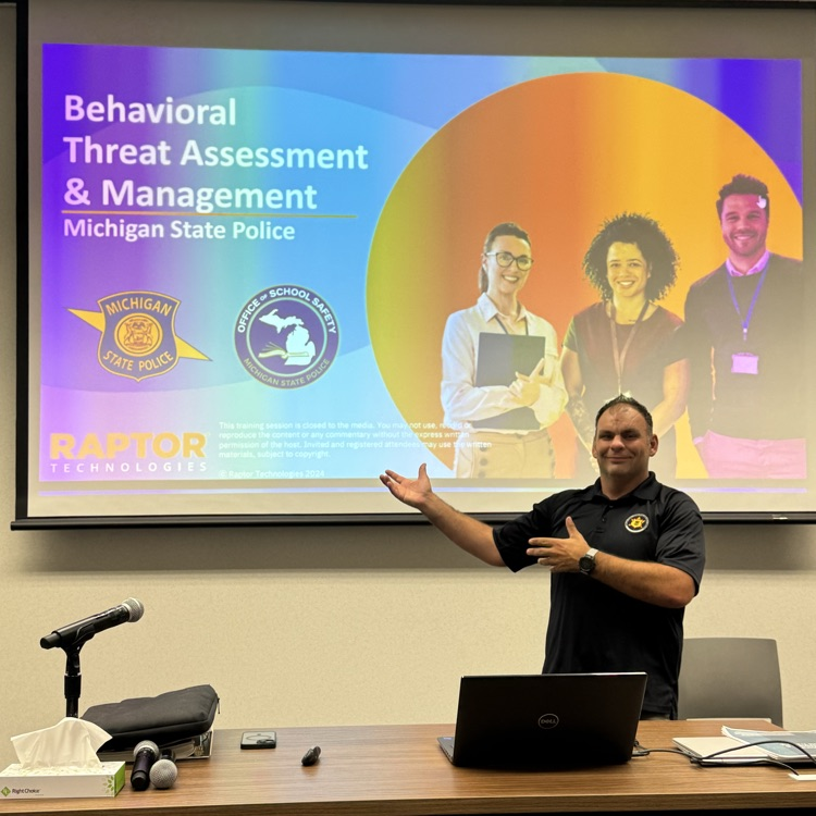 man standing in front of projection of a slide deck for Behavioral Threat Assessment Training