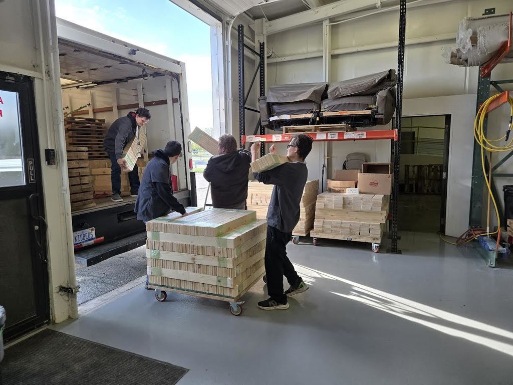 Students loading a truck with supplies
