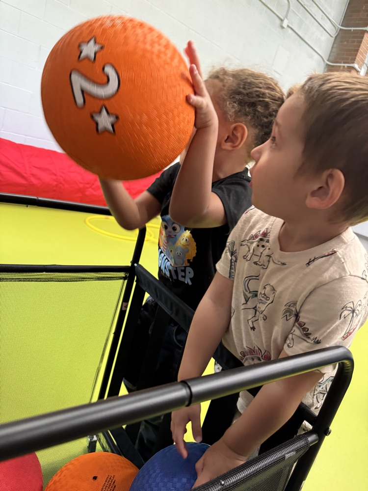 students getting balls from carts