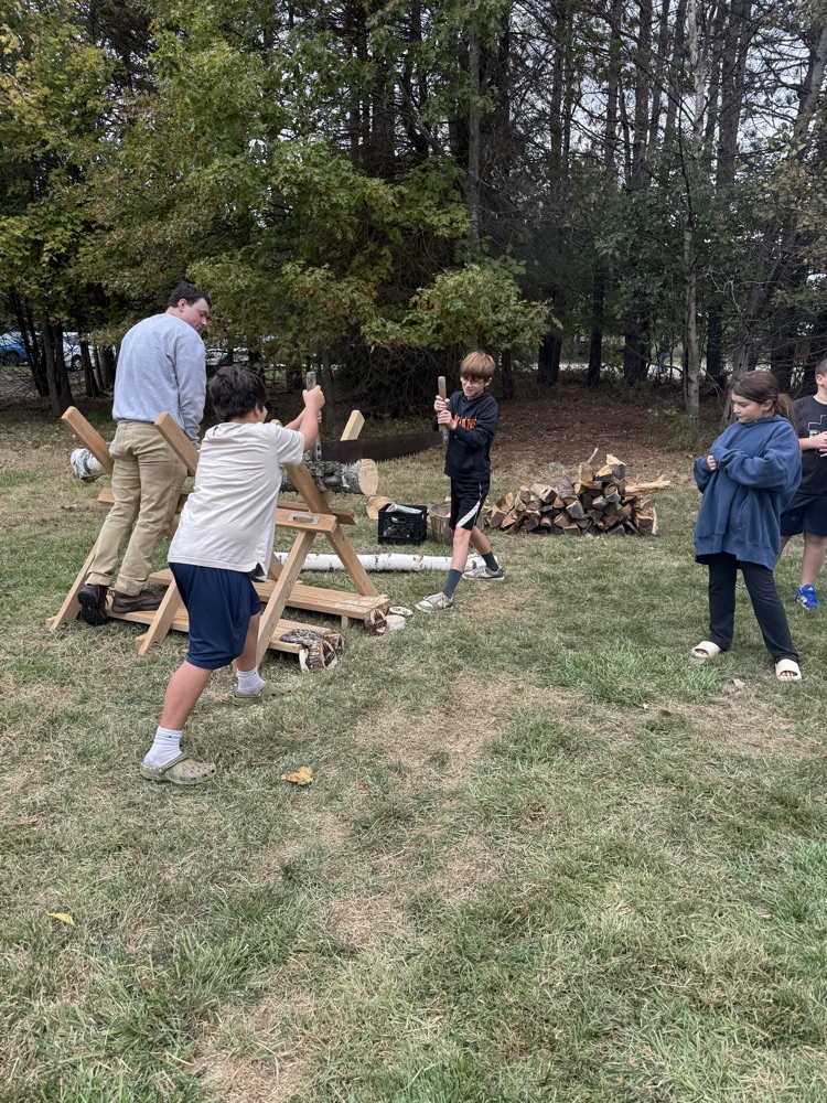 Kids cross cut sawing
