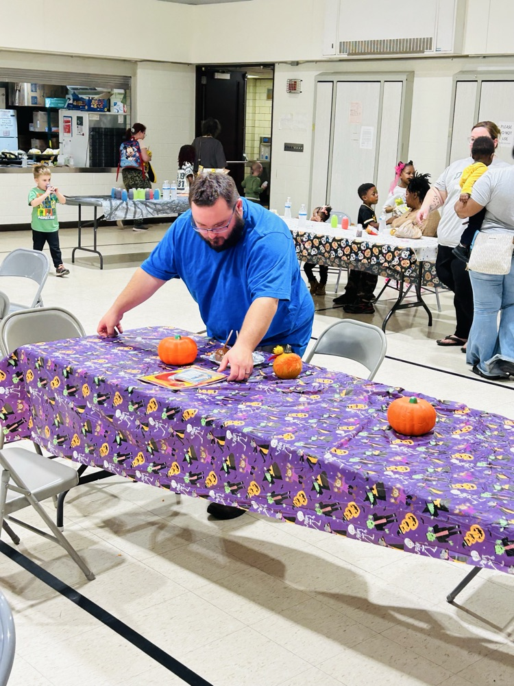 A parent helps by keeping things tidy.
