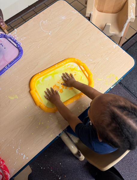 student enjoying sensory play