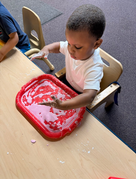 student enjoying sensory play